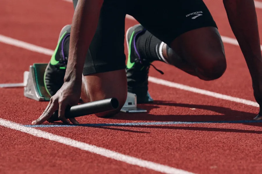 A sprinter setting off from starting blocks on a running track